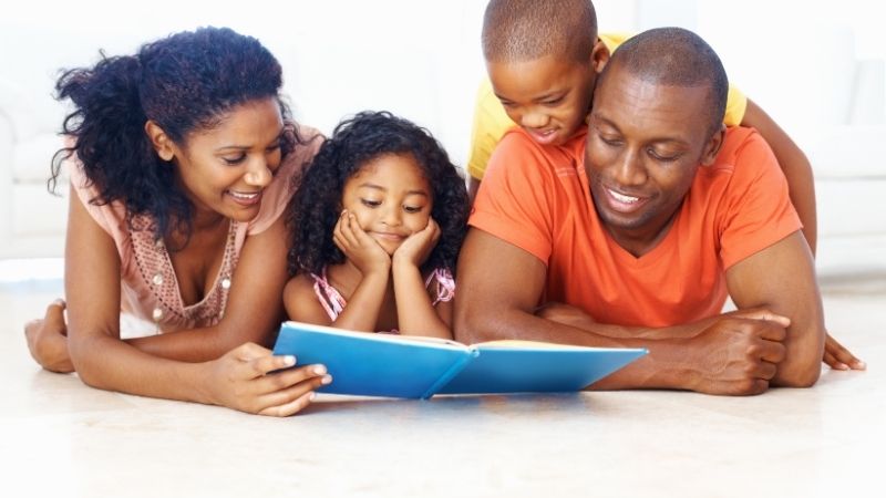 A family reading a book together