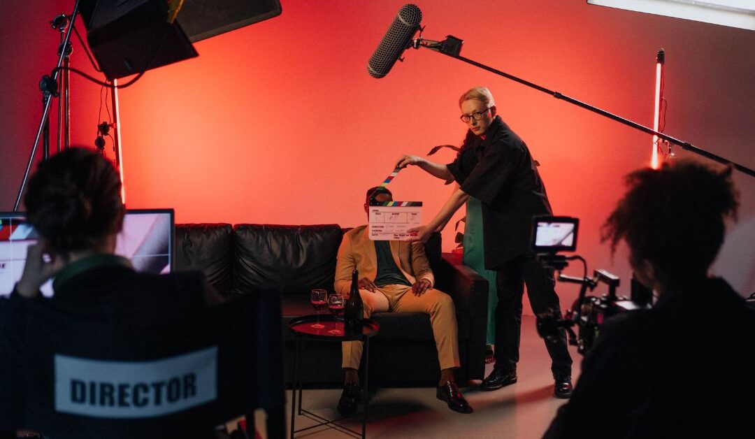 Movie set with a black character sitting ready to shoot